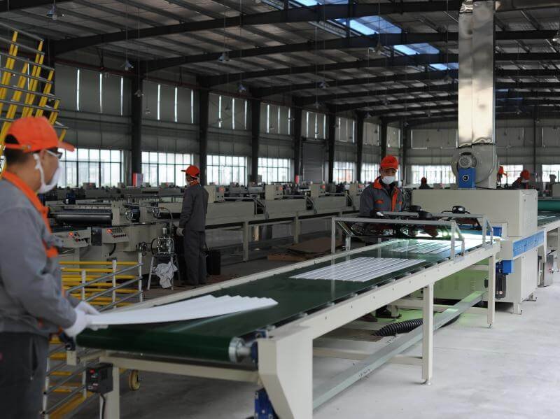 Automated coating and staining line applying UV-cured water-based paint to wood slats