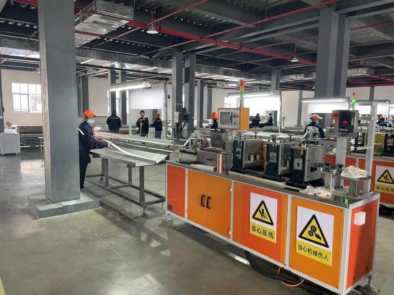 Automated coating and wood-grain embossing process applied to PVC venetian blind slats