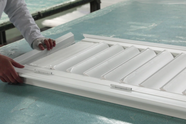 Bright Shutters factory floor -- automated assembly stations and quality control inspection area