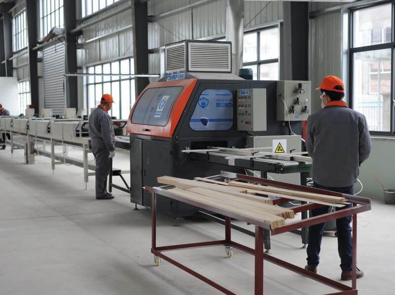 CNC machining centres processing wood shutter components with precision
