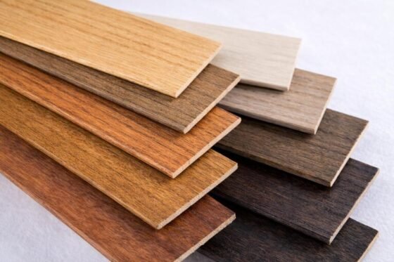 Close-up surface texture of painted and stained venetian blind slats showing finish quality