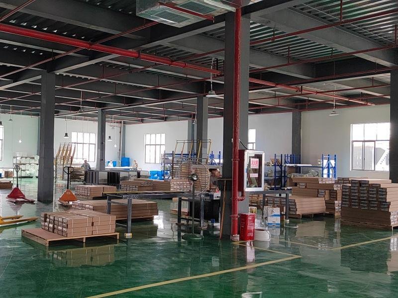 Final quality control inspection and packaging of finished faux wood venetian blinds at Bright Shutters