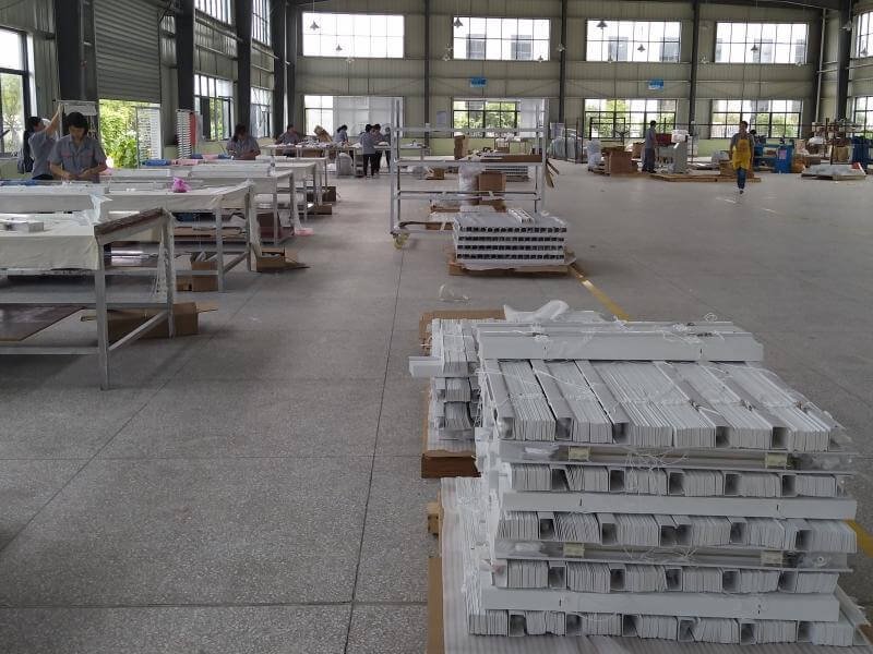 Final quality control inspection of finished wood venetian blinds -- tilt function, alignment and finish check