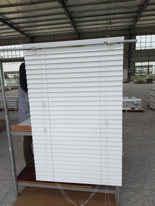 Faux wood venetian blinds installed in a modern bathroom -- moisture-resistant PVC composite slats