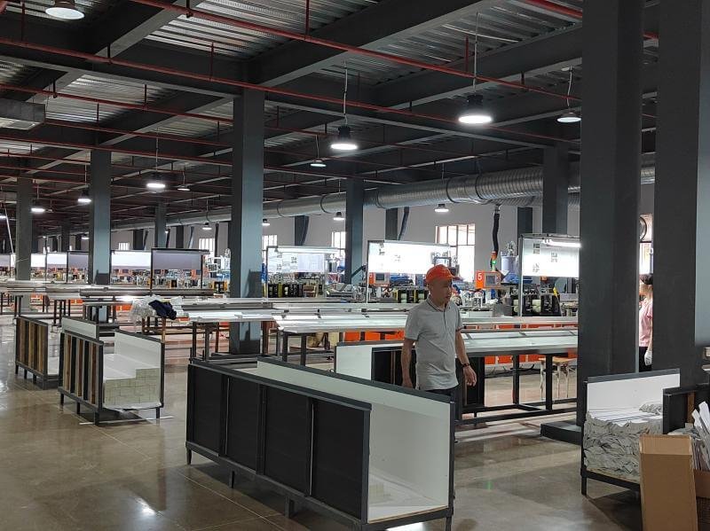 PVC extrusion lines producing faux wood venetian blind slat profiles at Bright Shutters factory