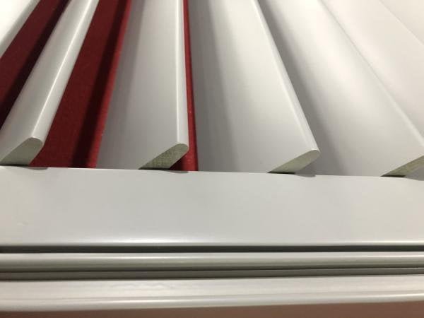 Plantation shutter frame and louvre close-up -- wood grain finish