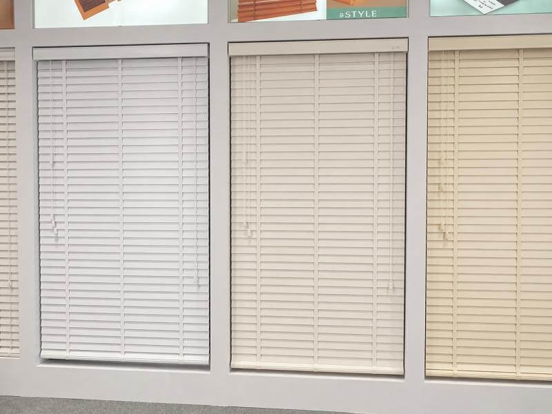 Wood venetian blinds in white painted, off-white, and cream finishes
