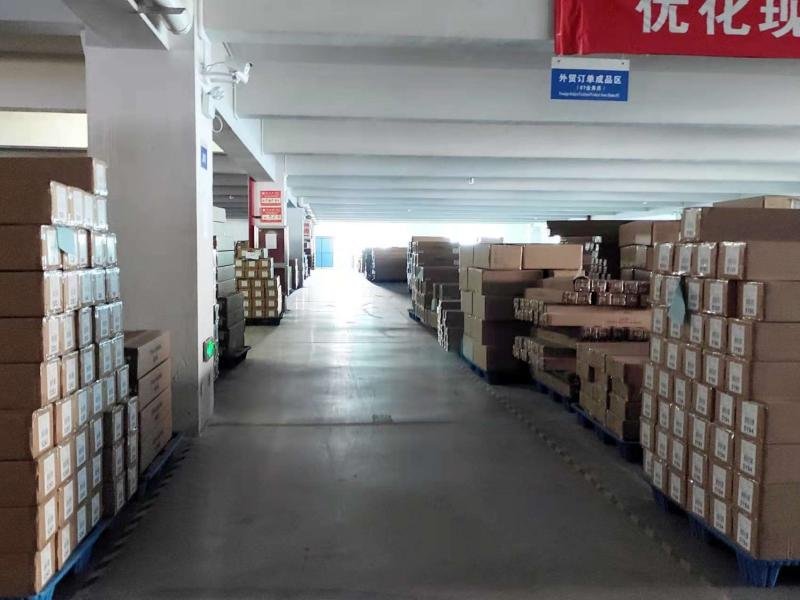 Packaging station - final quality check and carton preparation