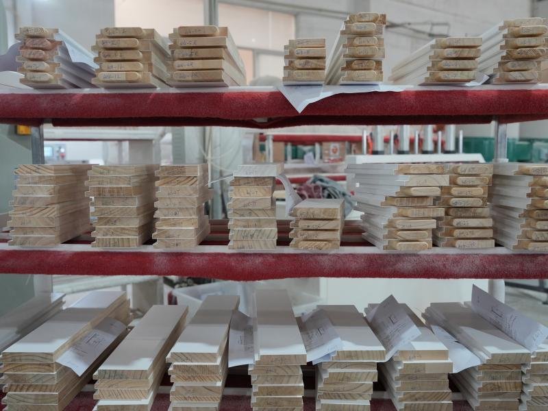 Three-pass sanding sequence with automated belt sanders and hand-sanding